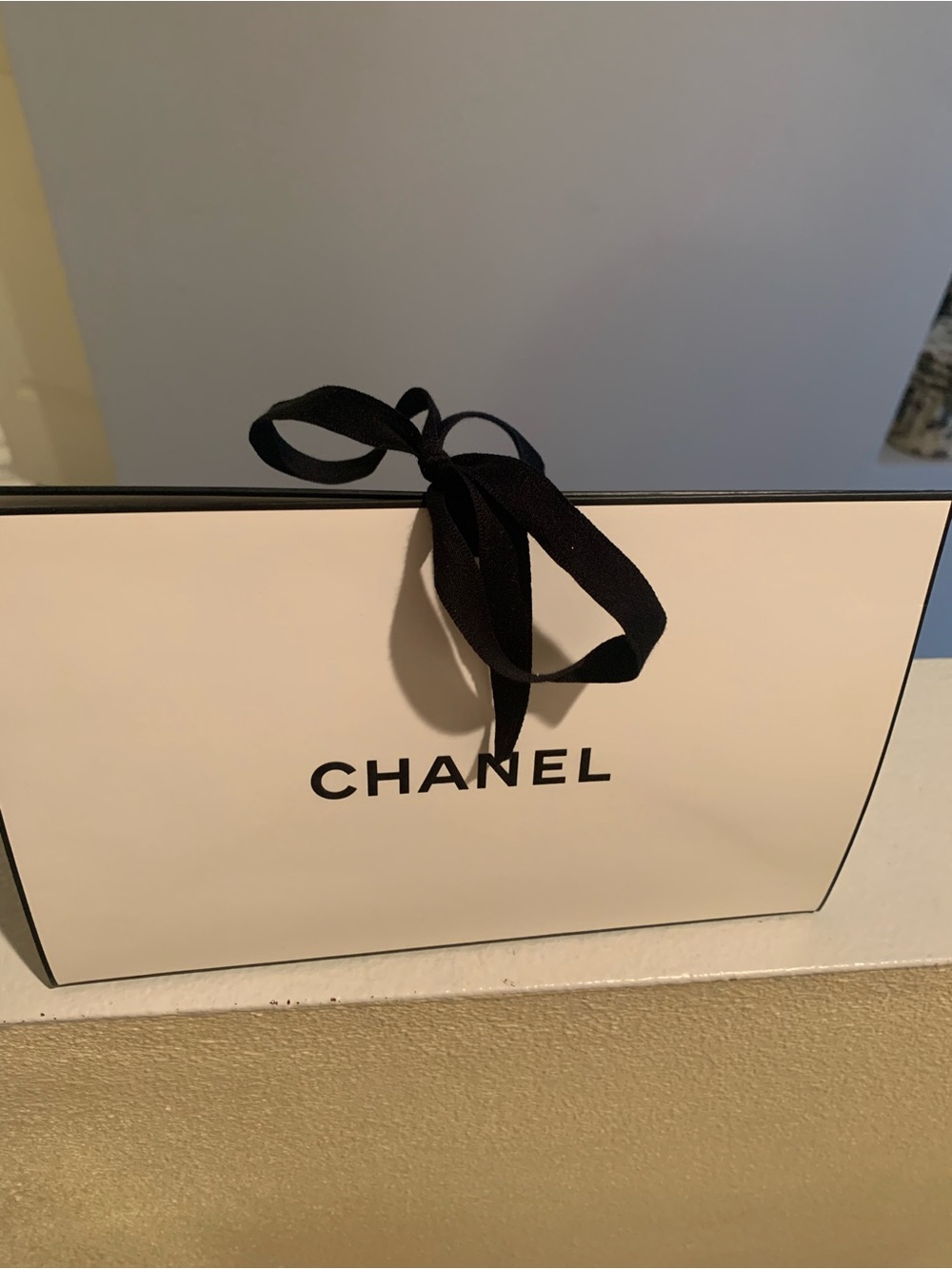 CHANEL Gift Bag with Black Ribbon with face cream samples and perfume sample